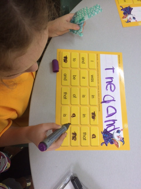 Magic Words sight words Learning Boards for learning to read the most frequently used words in reading. Child using the sight words learning board.